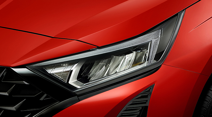 HEAD LAMP GARNISH - BLACK